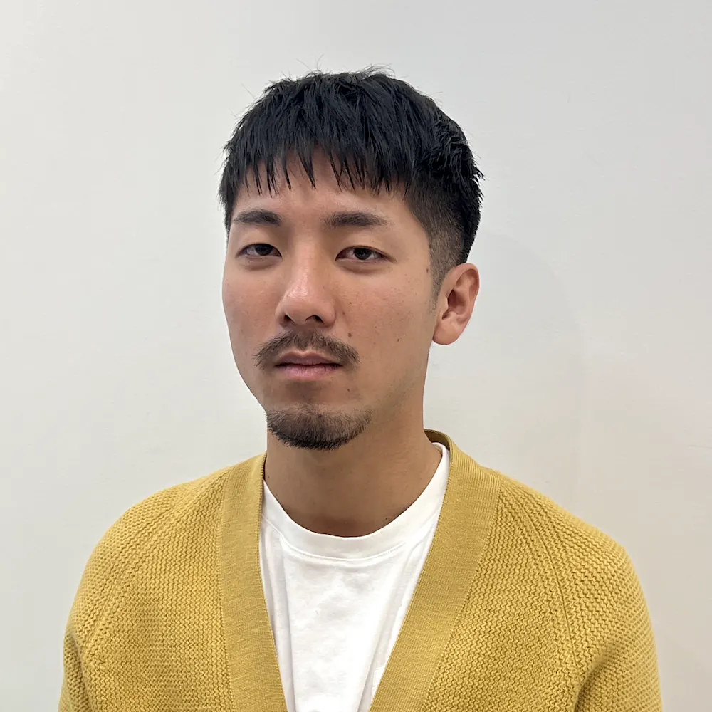 Short textured men’s haircut with a fringe